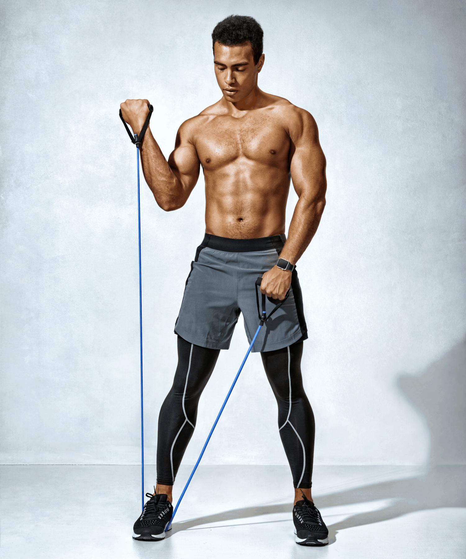 man doing workout with botthms resistance band